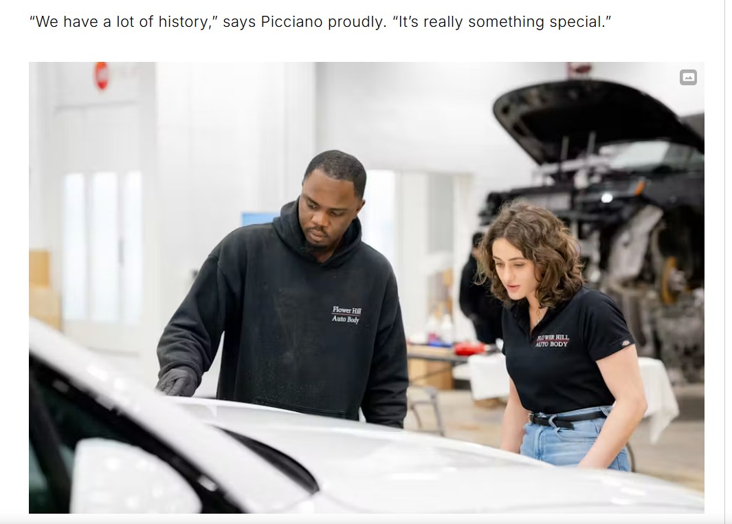 Ghaliya Ibrahim reviewing a vehicle repair with a technician on the Flower Hill Auto Body shop floor